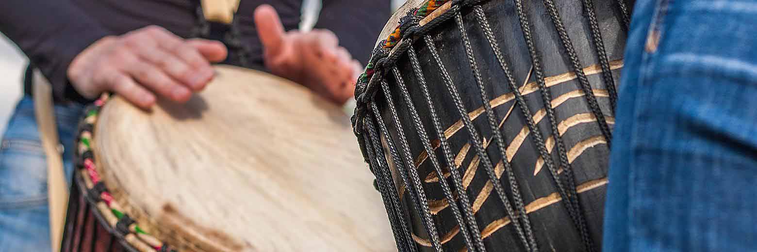 people-playing-djembe-drums