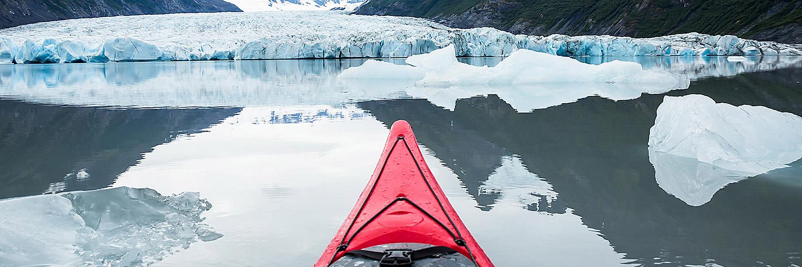 red-kayak-floating-among-icebergs-spencer-glacier-alaska