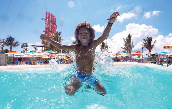 perfect-day-coco-cay-tidal-wave-pool-boy-jumping